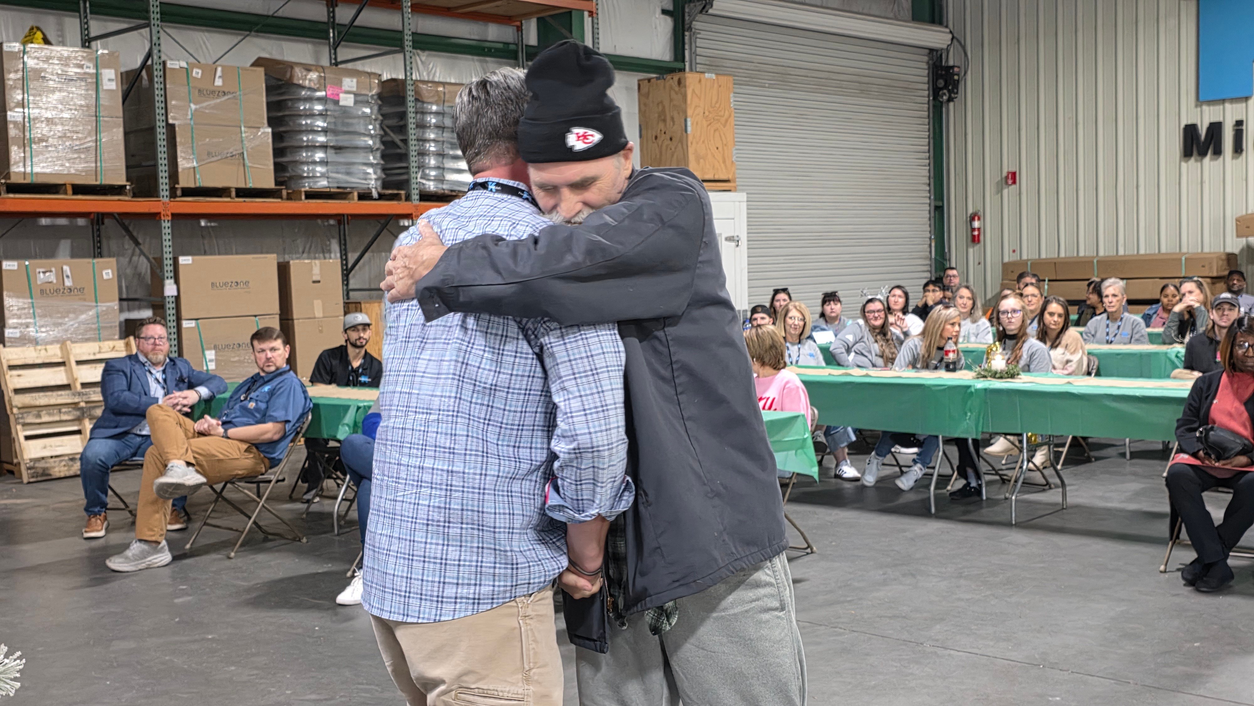 Bud McKee Hugs Rand McLaughlin