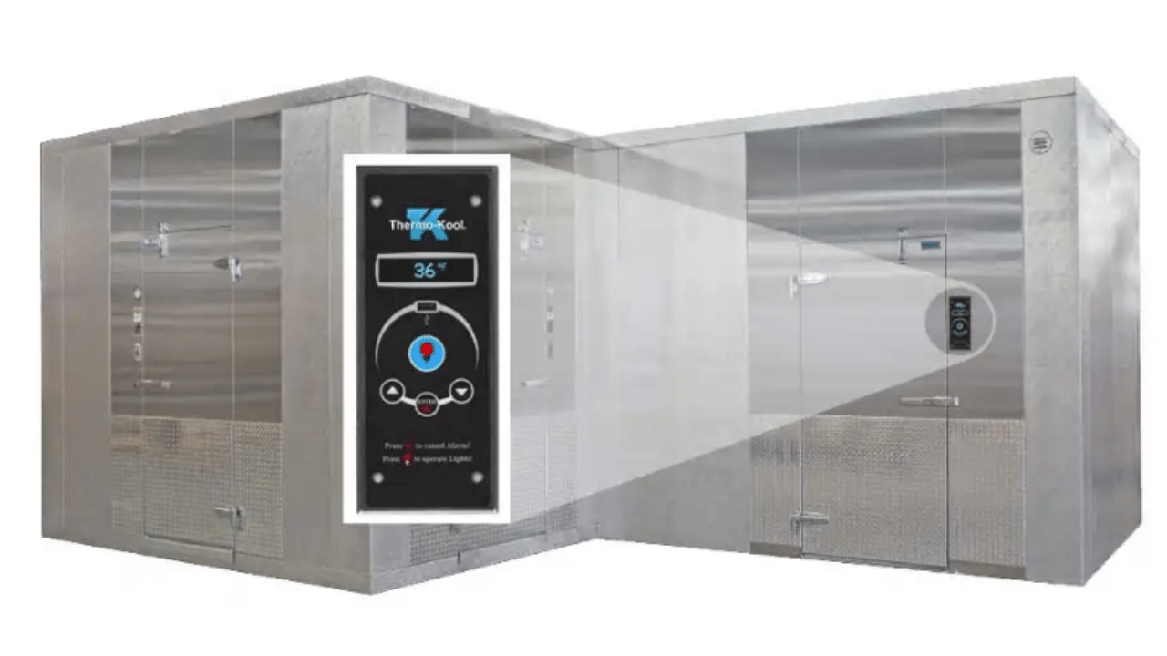 Image of silver walk-in coolers next to each other. In a large callout that juts forwards it shows the Thermo-Kool panel for their monitoring system. It's black and has the Thermo-Kool logo on top. Under is the temperature and then three buttons. 