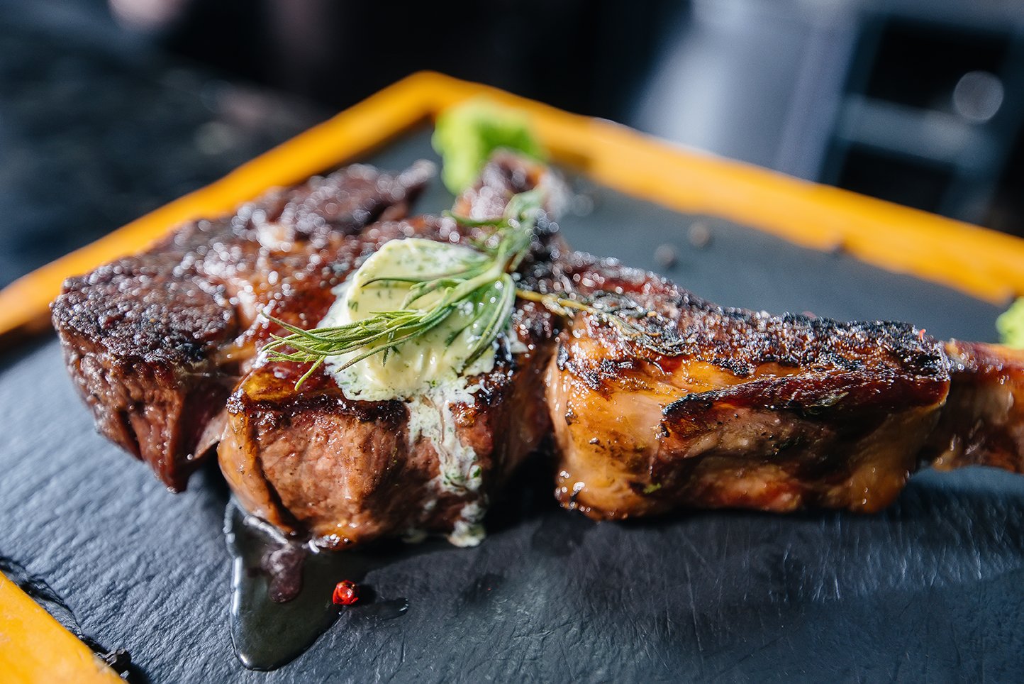 close-up-beautifully-grilled-juicy-steak-with-butter-seasonings