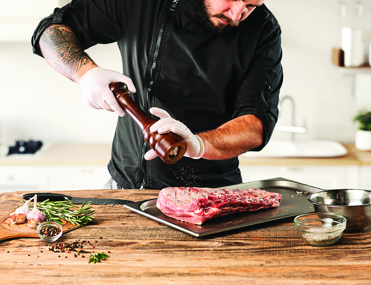 man-cooking-meat-steak-kitchen